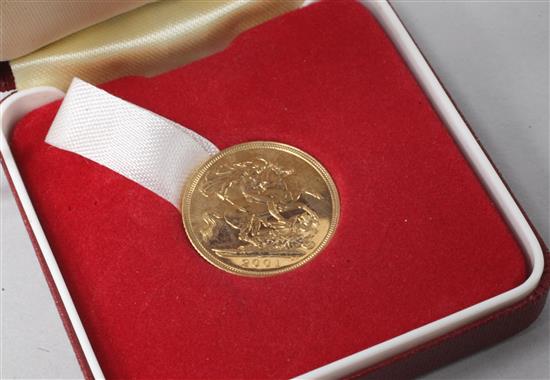 A cased 2001 gold full sovereign.
